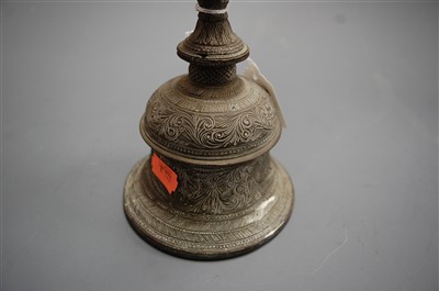 Lot 20 - A Tibetan brass hand-bell, having all-over...