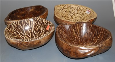 Lot 28 - A set of four coconut husk table bowls