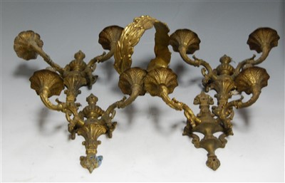 Lot 144 - A set of four Rococo style brass twin sconce...