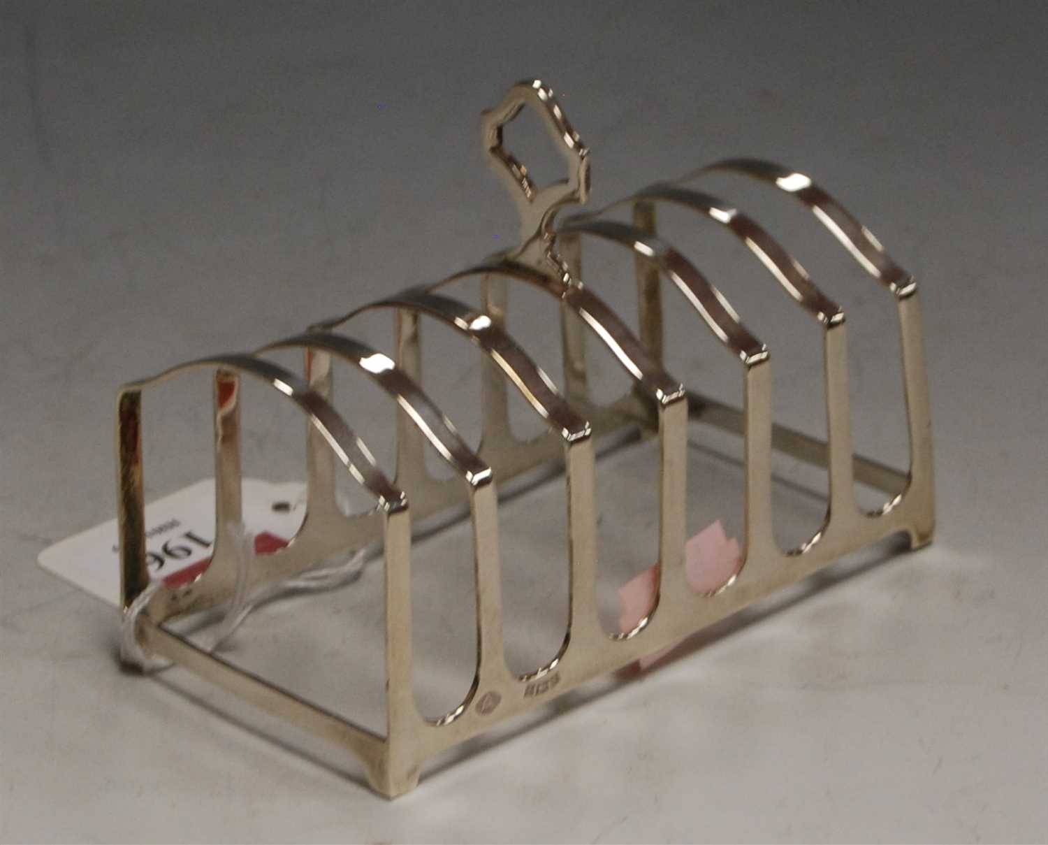 Lot 196 - A modern silver six division toast rack by...