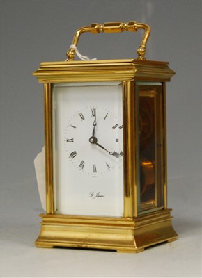Lot 223 - A modern lacquered brass cased carriage clock,...