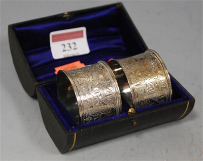 Lot 232 - A pair of George V silver napkin rings, each...