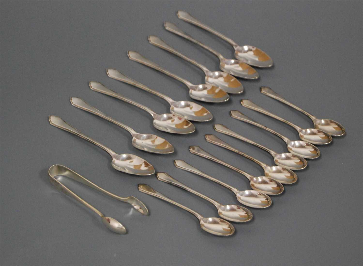 Lot 239 - A set of nine modern silver teaspoons by...