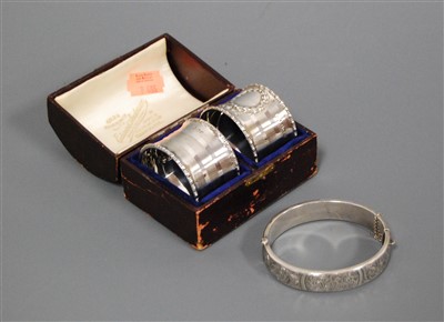 Lot 240 - A pair of George V silver napkin rings, each...