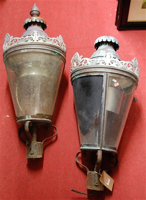 Lot 1074 - A pair of wrought metal and copper lanterns of...