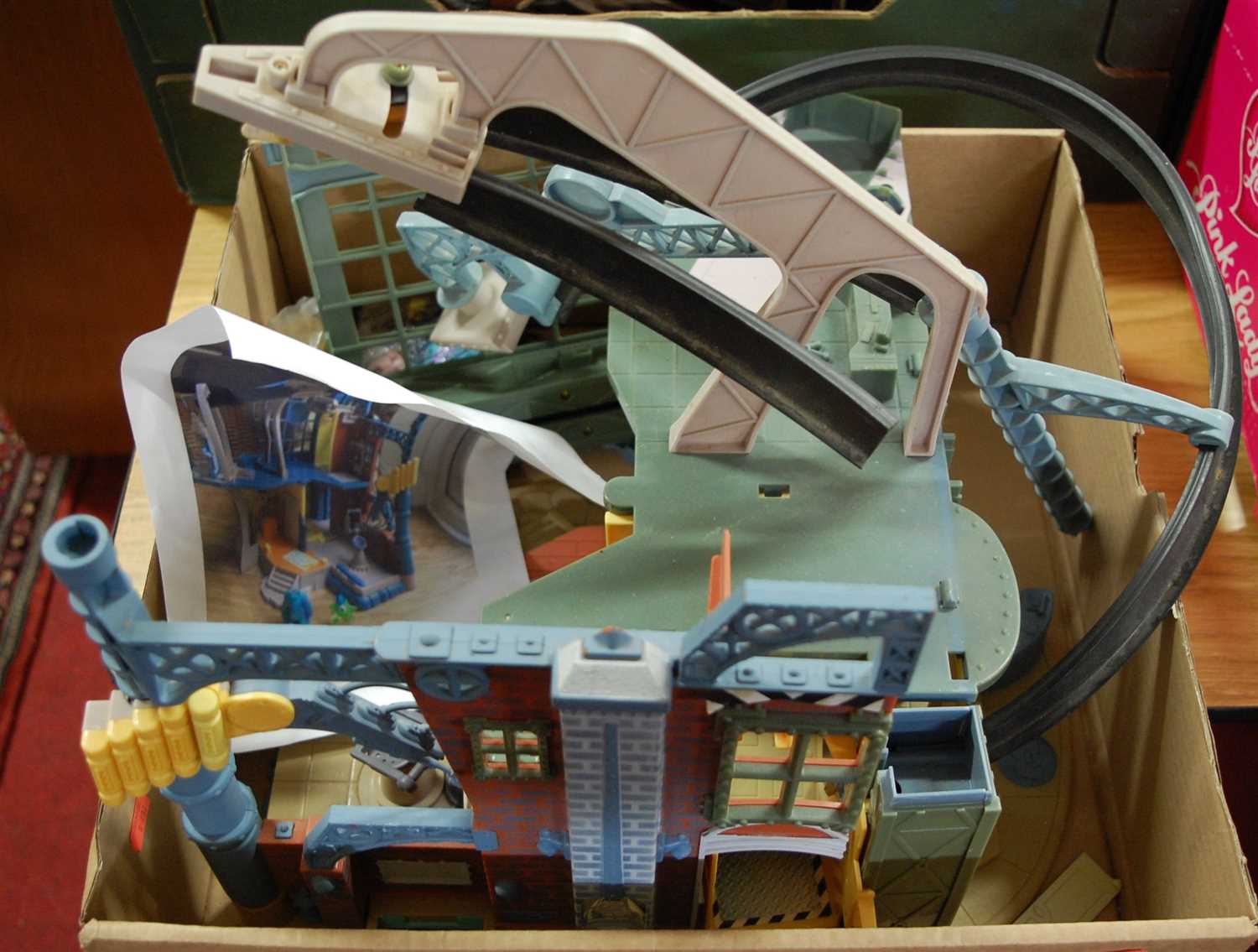 Lot 551 - A box containing a Monsters Inc Factory by...