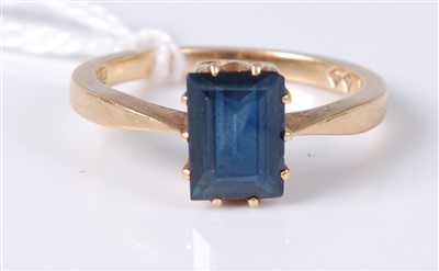 Lot 303 - A 15ct gold sapphire ring, the claw set...