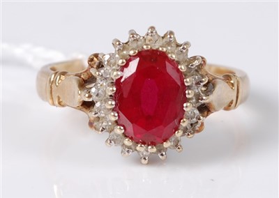 Lot 304 - A 9ct gold, ruby and diamond dress ring, the...