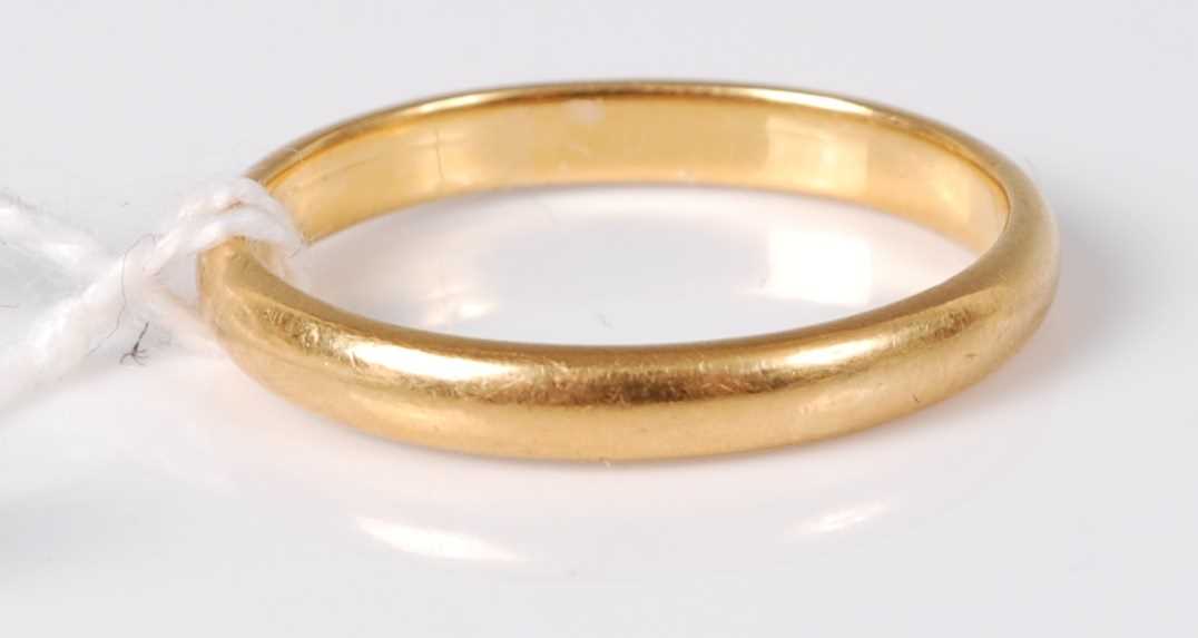 Lot 306 - A 22ct gold wedding band, 3.5g, size M...