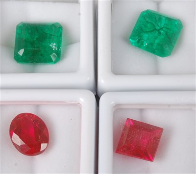 Lot 312 - Four modern loose gem stones, with...