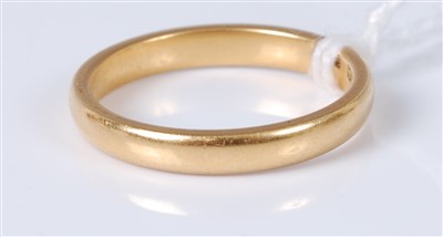 Lot 323 - A 22ct gold wedding band, 3.6g, size L+