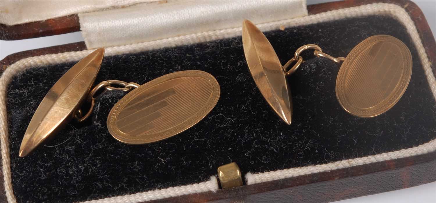 Lot 331 - A cased pair of gent's engine turned 9ct gold...