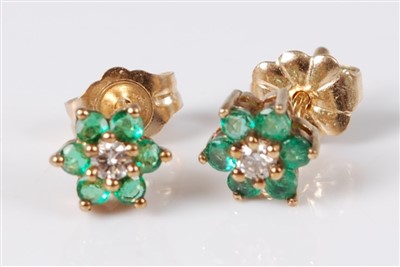 Lot 335 - A pair of 9ct gold, emerald and diamond flower...