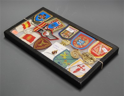 Lot 343 - A collection of assorted military cloth titles...