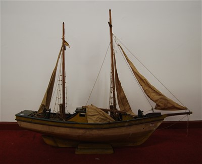 Lot 403 - A scratch built model of a sailing boat with...