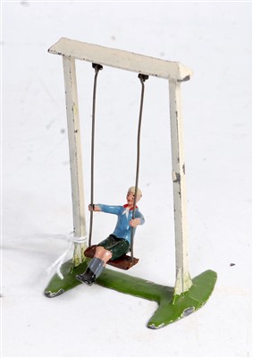 Lot 1317 - A Britains No. 619 boy on swing, comprising of...