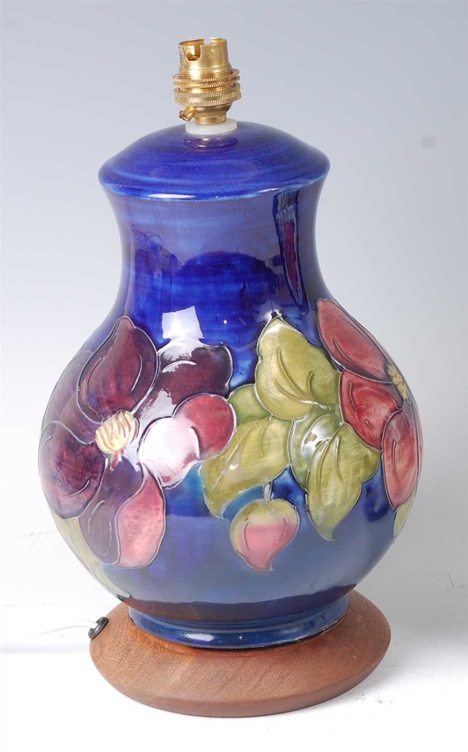 Lot 24 - A Moorcroft pottery table lamp in the Anemone...