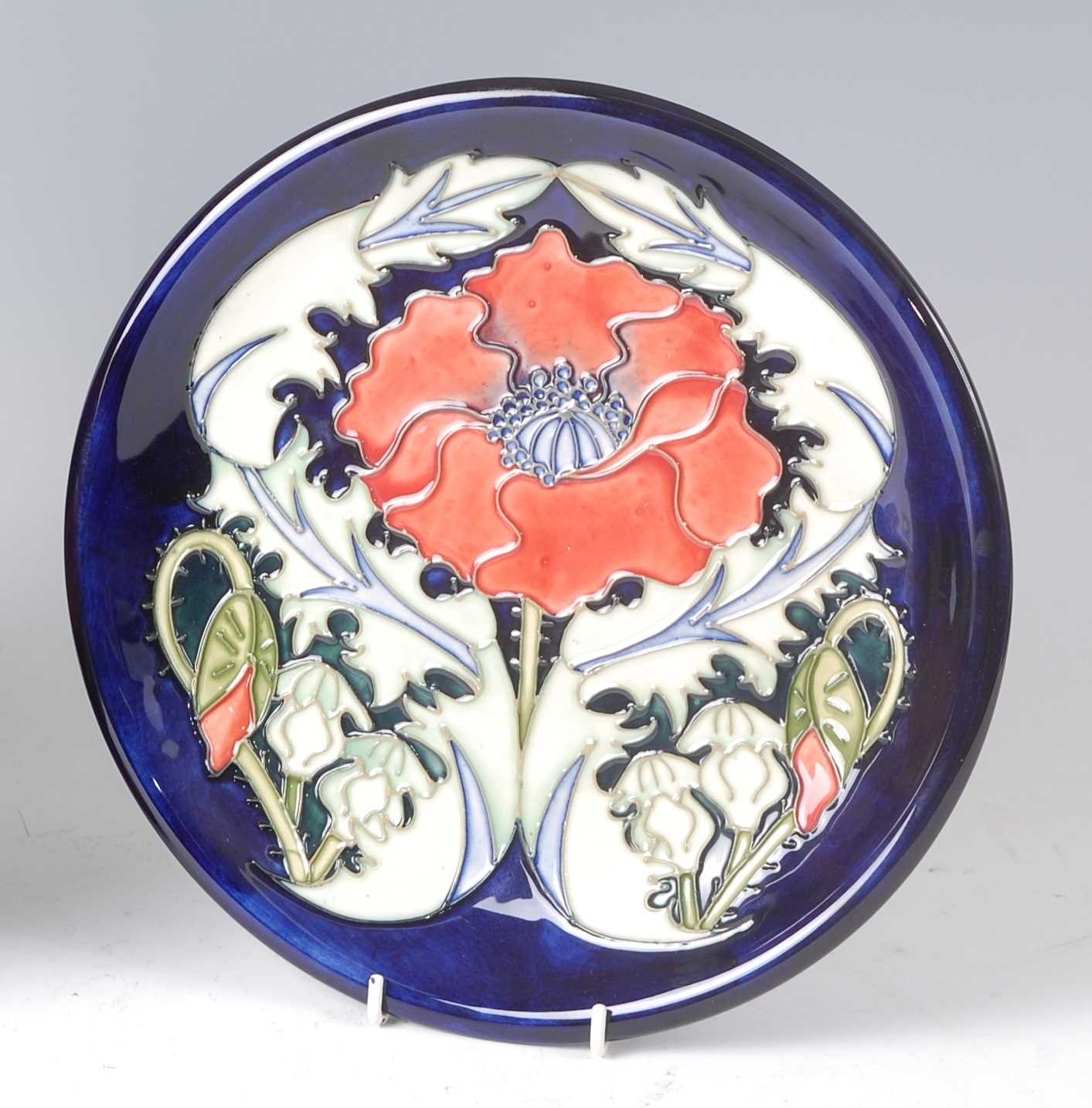 Lot 148 - A Moorcroft pottery plate in the Poppy pattern,...