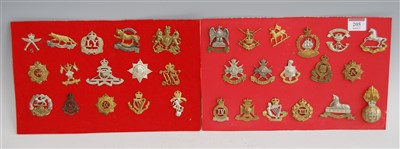 Lot 205 - A collection of assorted military cap badges,...
