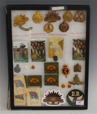 Lot 207 - A collection of Australian cap badges and...