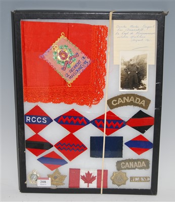 Lot 208 - A collection of Canadian cap badges, cloth...