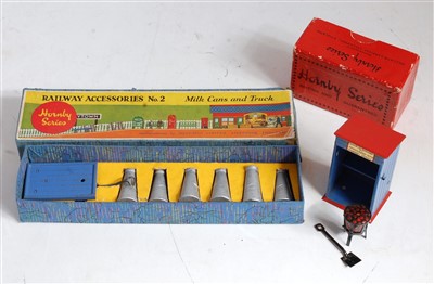 Lot 594 - A Hornby railway accessories No. 2 milk cans...