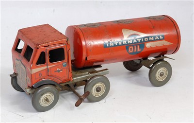 Lot 3179 - A Mettoy tinplate and clockwork International...