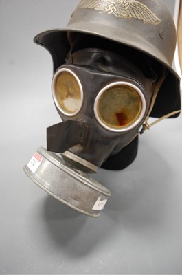 Lot 252 - A German Luftschutz steel helmet, with logo;...