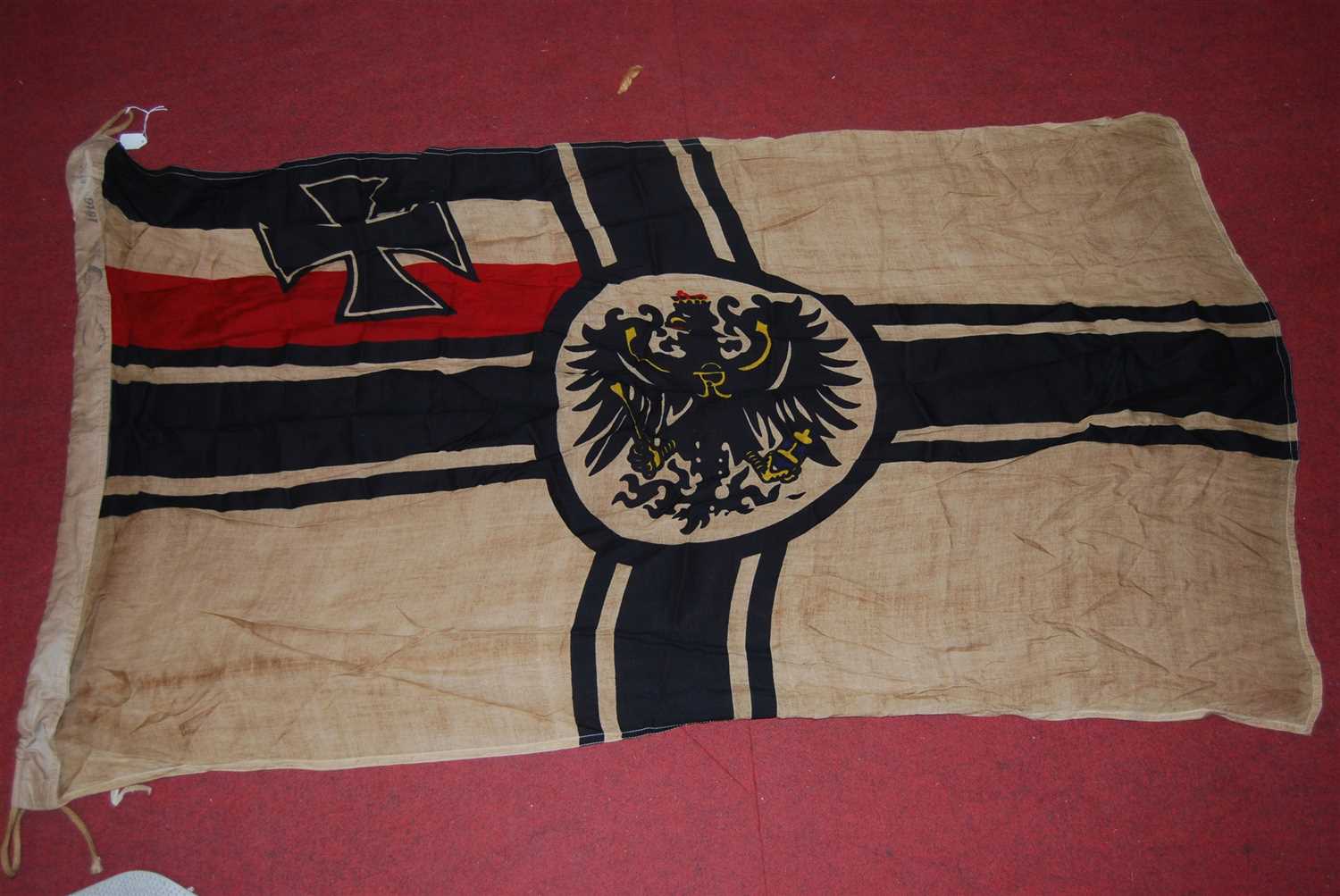 Lot 271 - An Imperial German flag, with various markings...