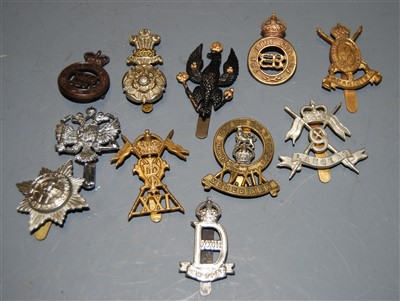 Lot 272 - A small collection of assorted cap badges, to...