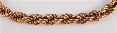 Lot 2510 - A yellow metal twisted rope link bracelet,...