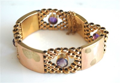 Lot 2542 - A 9ct gold and amethyst set link bracelet,...