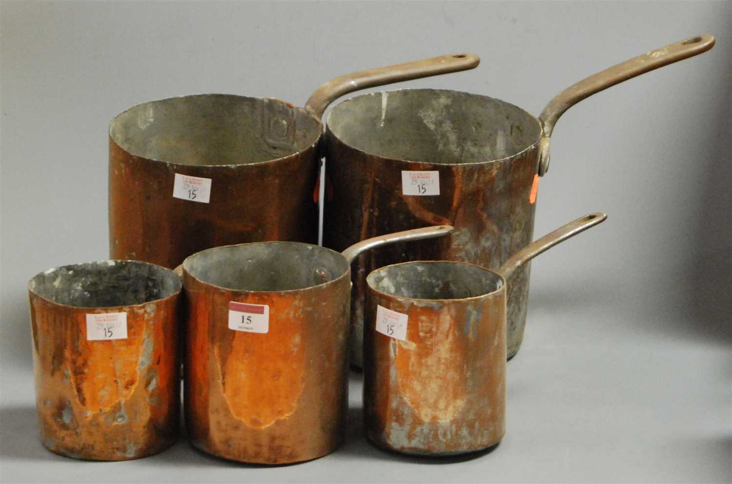 Lot 15 - A set of five 19th century riveted copper pans,...