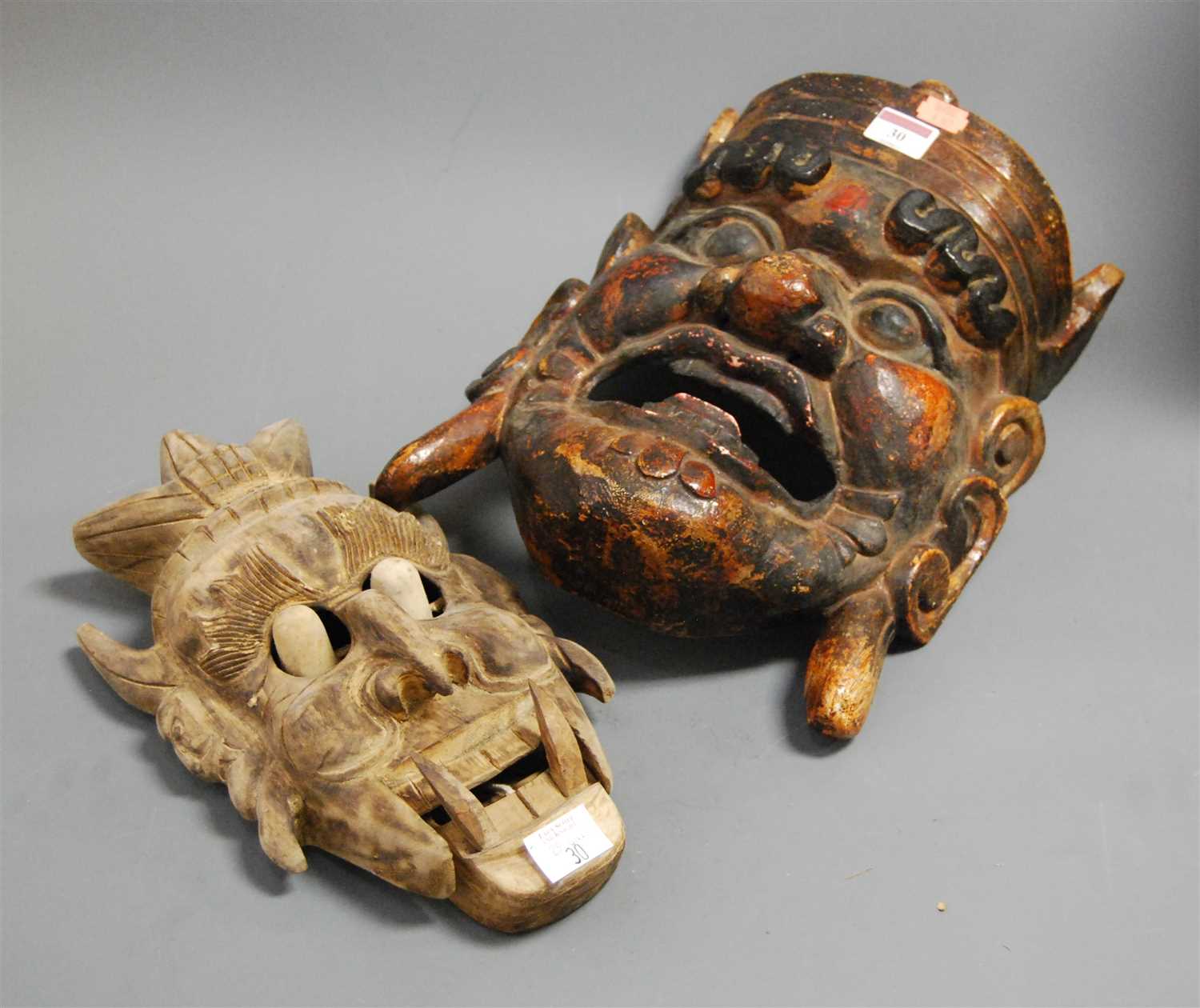 Lot 30 - A large carved softwood and painted tribal...