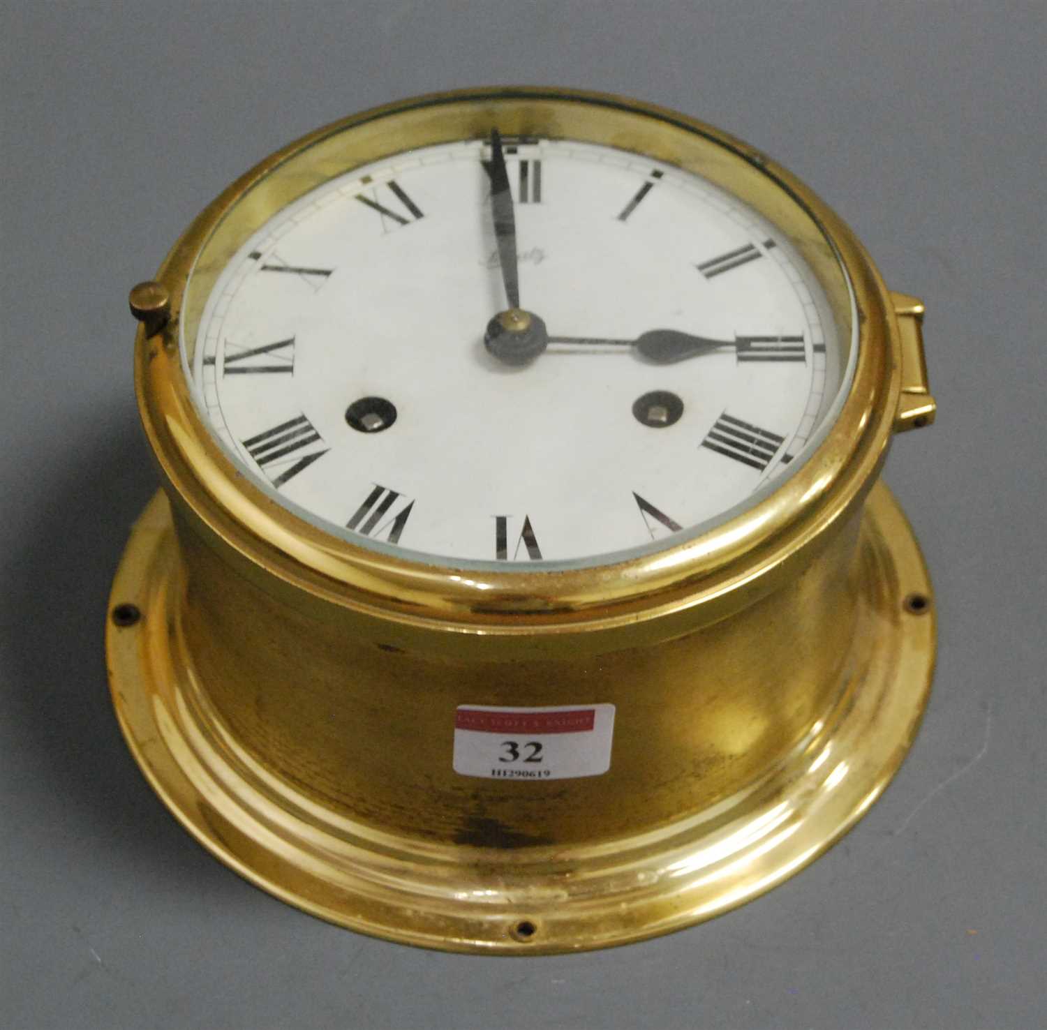 Lot 32 - A continental brass cased ships bulkhead clock,...
