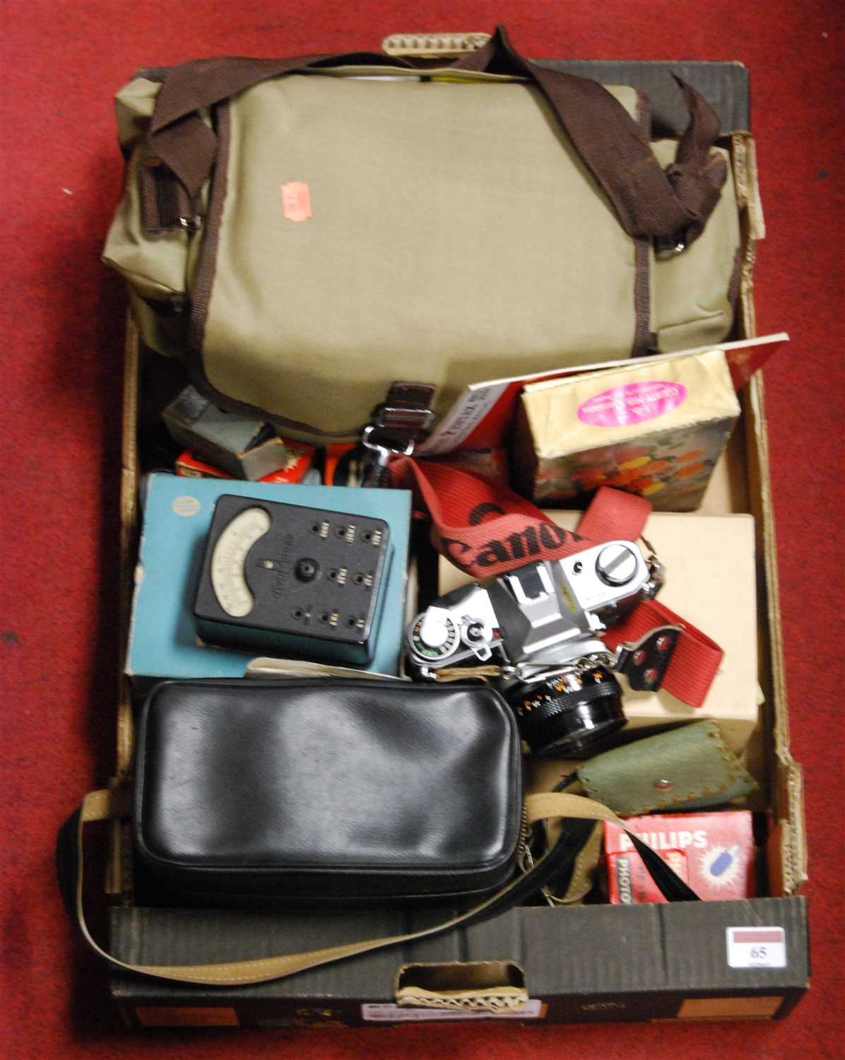 Lot 65 - A box of miscellaneous cameras and accessories,...