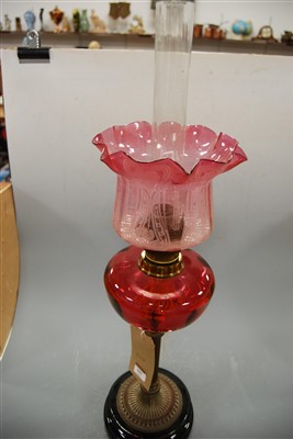 Lot 103 - A late Victorian oil lamp, having an etched...