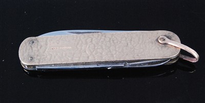 Lot 408 - A two blade pocket knife in textured 9ct gold...