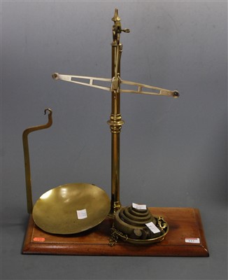Lot 112 - A set of early 20th century brass beam scales...