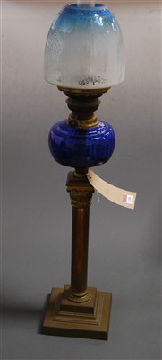 Lot 130 - A Victorian oil lamp, having a blue tinted...