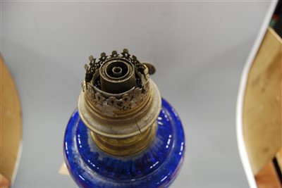 Lot 130 - A Victorian oil lamp, having a blue tinted...
