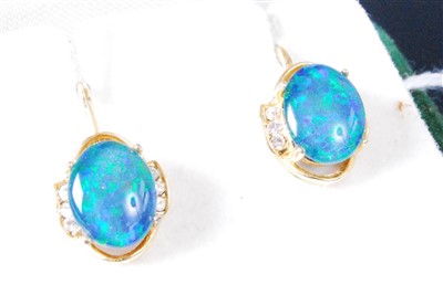 Lot 438 - A pair of yellow metal, opal and cz set ear...