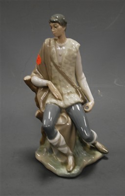Lot 310 - A large Lladro porcelain figure of a young man...