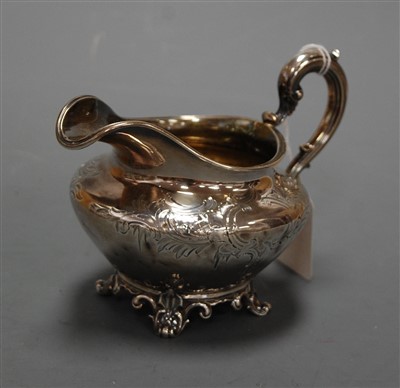 Lot 314 - A Victorian silver cream jug, having floral...