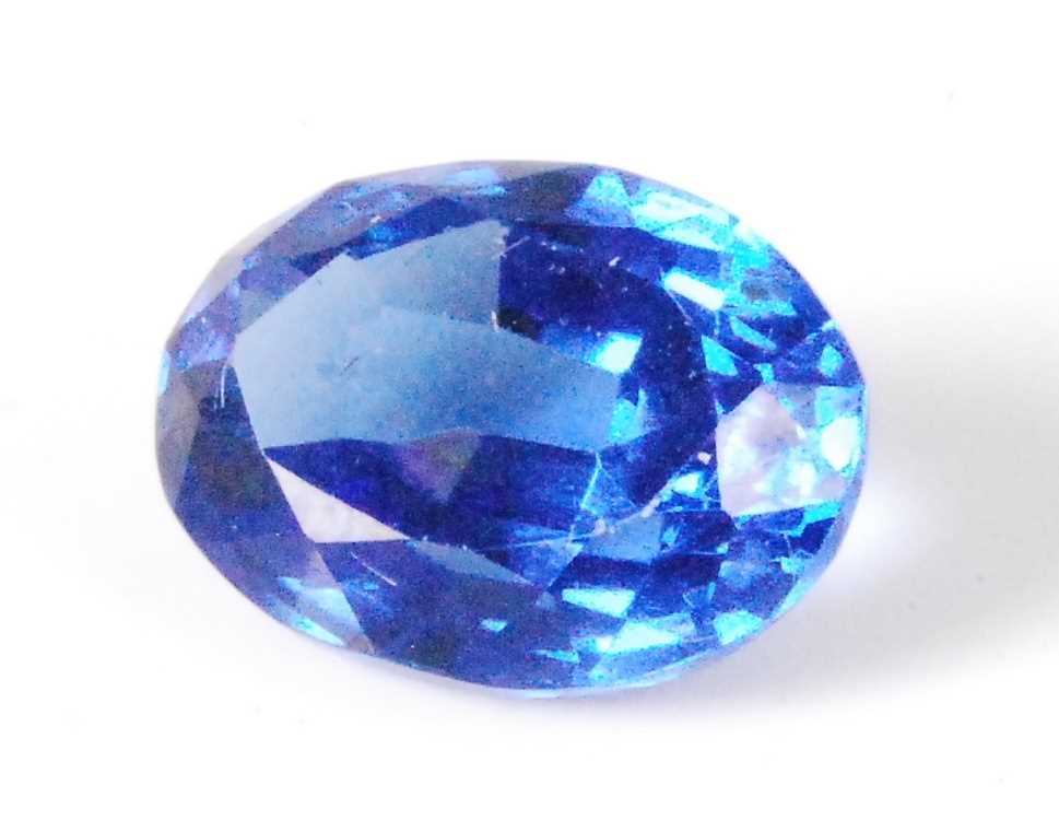 Lot 443 - A loose heat-treated natural sapphire, blue...