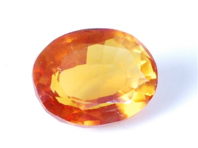 Lot 446 - A loose heat-treated natural orange sapphire,...
