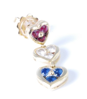 Lot 448 - A single yellow metal, ruby, sapphire and...