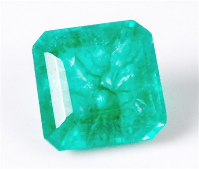 Lot 473 - A loose enhanced natural emerald, of green...