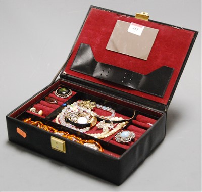 Lot 485 - A leather clad jewellery box and contents, to...