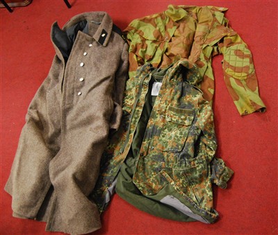 Lot 509 - A box of assorted post-WWII military uniforms...